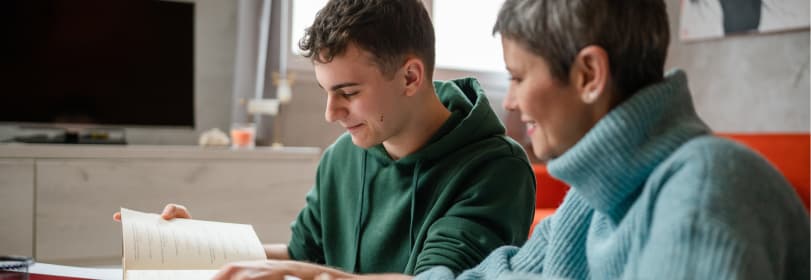 Image of a teacher helping a young person